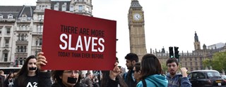 1240x480x22.08-RT-slavery-protest-feature-image-1240x480.jpg.pagespeed.ic.DsOwxsCfRq